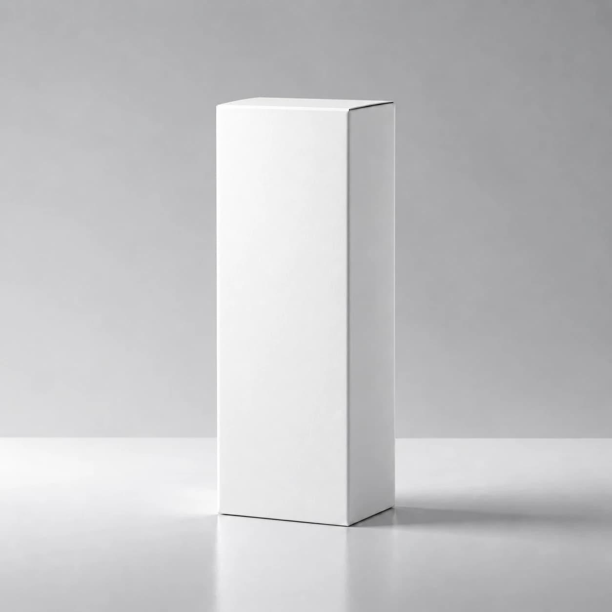 White paper perfume box on a pale grey surface